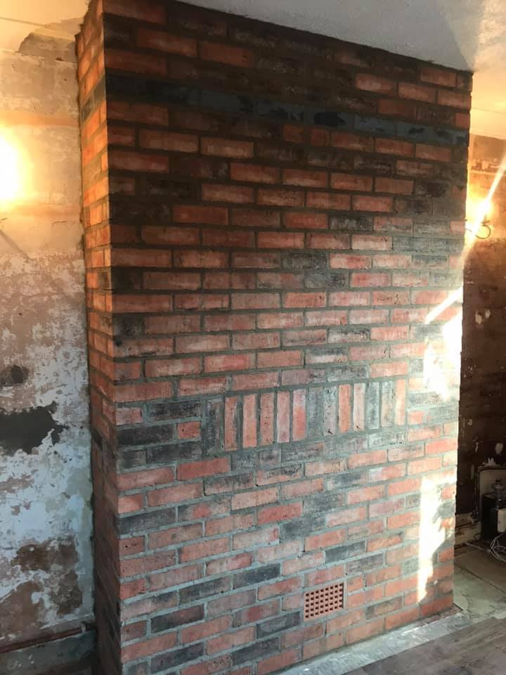 Picture of a fireplace being renovated - finished job